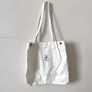 new in packaging white corduroy ‘you need this one, take care of laundry’ tote